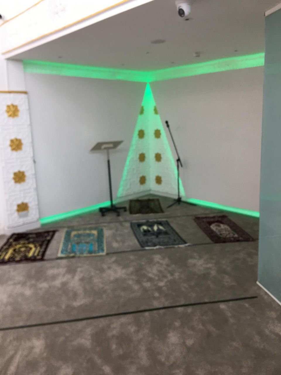 The mihrab with gold rosettes in the prayer hall